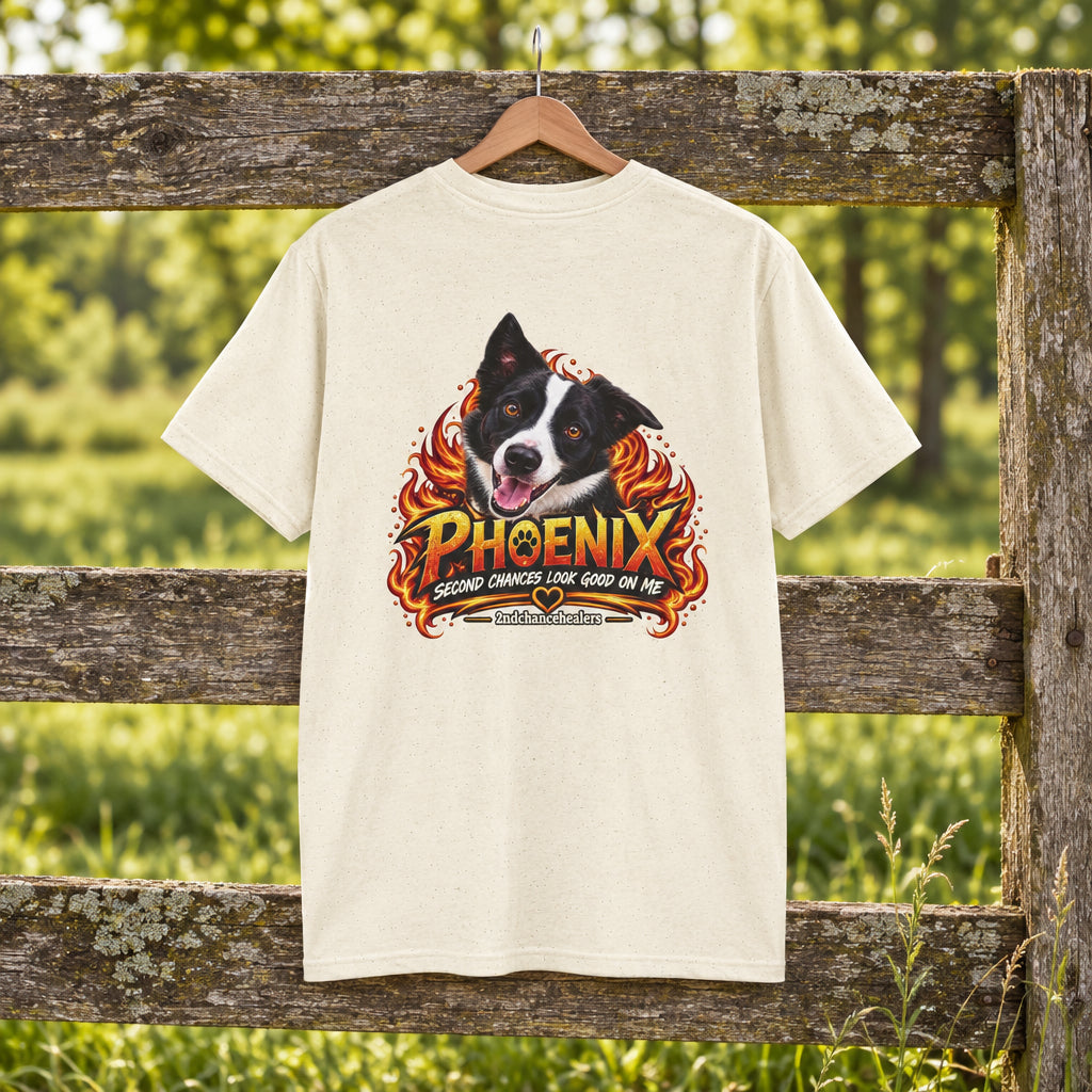 A cream-colored short-sleeve t-shirt with a large graphic print on the back featuring a black and white dog surrounded by flames and the text 'PHOENIX' and 'GOOD DOGS LOOK GOOD ON ME'.